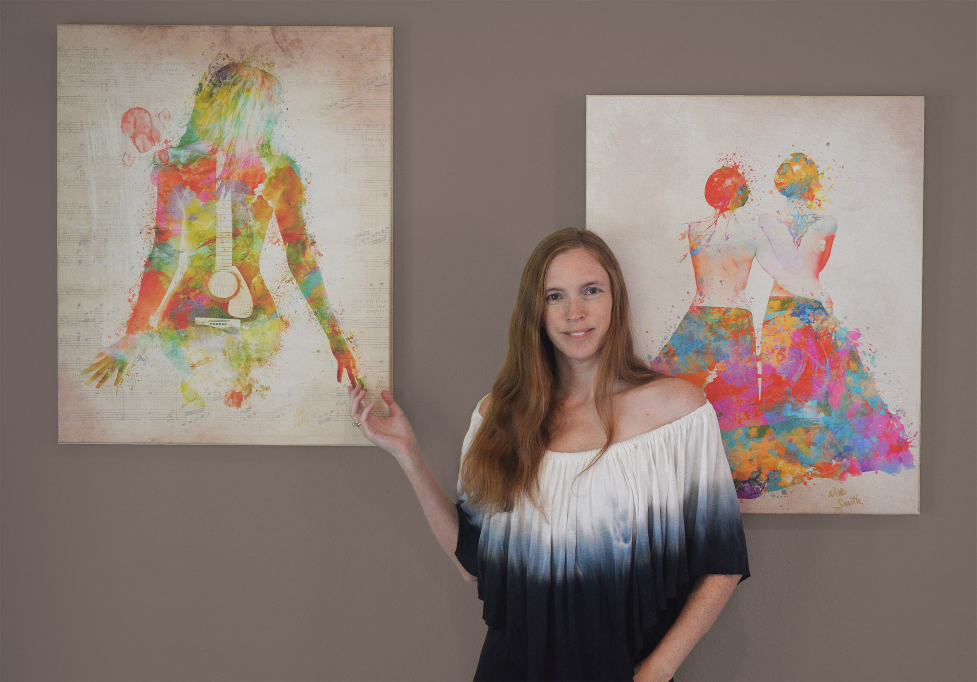 Artist Nikki Smith with her self-portrait "Music Was My First Love" and painting "Pride Not Prejudice"